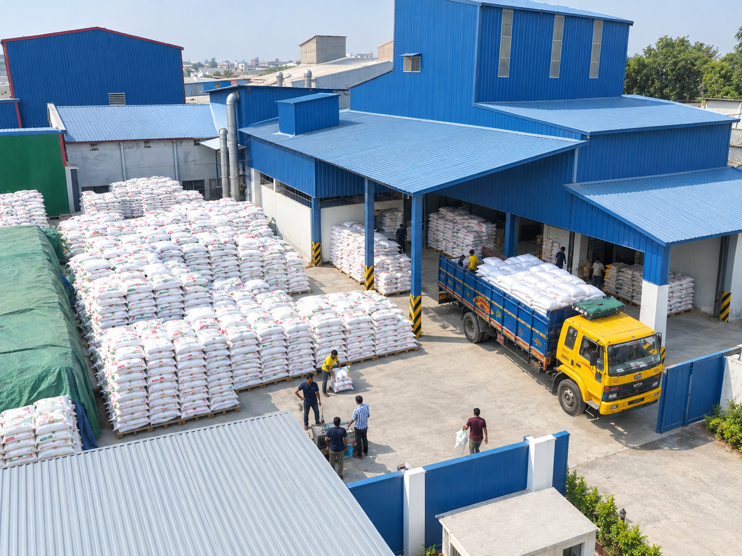Aerial view of the Roy Agro warehouse and sack yard with a truck being loaded